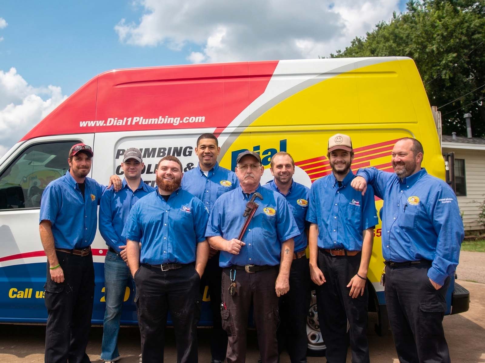 Dial One Johnson plumbing team standing together outside